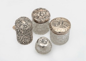 Four assorted antique sterling silver and glass vanity jars, 19th/20th century, the largest 7cm high