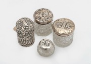 Four assorted antique sterling silver and glass vanity jars, 19th/20th century, the largest 7cm high