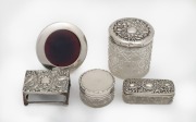 Three assorted antique silver topped vanity jars, a sterling silver circular picture frame, and a sterling silver oversized matchbox holder, 19th/20th century, (5 items), ​​​​​​​the largest jar 9cm high