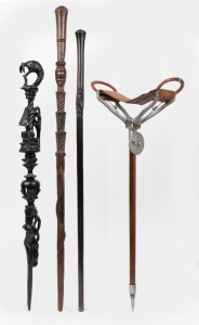 Three carved timber tribal walking sticks, together with a vintage hunting stick, (4 items), the largest 97cm long