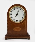 An antique French mahogany clock with marquetry shell inlay and barber pole stringing, timepiece only, early 20th century, 21cm high