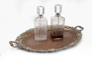 A pair of etched glass "Scotch" and "Gin" decanters with pump action dispensary, together with an antique silver plated tray (worn to copper), (3 items), 60cm across the handles