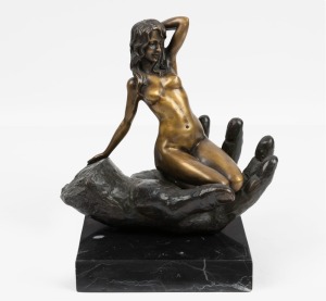 A French cast bronze statue of female nude kneeling in the palm of a hand, mounted on a stone base, 20th century, stamped "JUNO" with French foundry mark "BRONZE BARANTI, PARIS", 22cm high