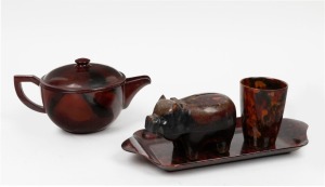Vintage bakelite&nbsp;teapot, beaker, tray and piggy bank, circa 1930s, (4 items), ​​​​​​​the tray 31cm wide
