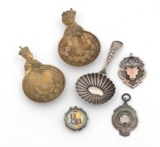 A Georgian silver caddy spoon, circa 1804, two Queen Elizabeth II Coronation caddy spoons, two&nbsp;antique silver fobs (one with rose gold highlights), and an enamel Queen Victoria silver coin mounted as a pendant, 19th/20th century, (6 items)