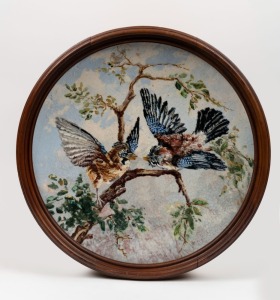 An antique hand-painted circular and convex porcelain plaque with bird decoration, signed lower left (illegible), 19th/20th century, framed 44cm diameter overall
