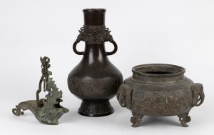 A Chinese bronze vase, hanging oil lamp and pot with elephant handles, 19th and 20th century, the largest 31cm high
