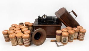 An American Standard Edison Phonograph, original dome-top case, horn, handle and twenty-four cylinders, 29cm high, 34cm wide, 24.5cm deep