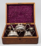 An antique English silver plated three piece tea service with ivory finial, attractively housed in a walnut and string inlay case with purple silk and velvet plush lining, 19th century; together with silver plated mustard pot and salt shaker, (3 items), t - 2