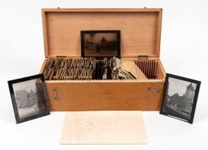 A storage box containing approximately 30 annotated glass magic lantern slides (mainly European and South African subjects), also a quantity of negatives in individual pockets.