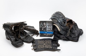 MAD MAX - THE ROAD WARRIOR: An original prototype costume ensemble for the film "Mad Max : The Road Warrior" (Warner Brothers, 1981). The components comprise of a distressed leather jacket, a leather-studded-spiked-arm-cuff, and a pair of lace-up leather 