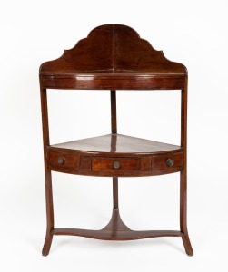 An English George III mahogany bow fronted corner washstand with three drawers and ebony string inlay, circa 1790, 104cm high, 63cm wide, 45cm deep