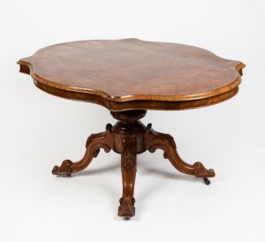 An antique English walnut centre table with quarter book matched burr walnut veneered top and serpentine edge, standing on quadraform cabriole leg pedestal base, circa 1870, ​​​​​​​82cm high, 145cm wide, 107cm deep