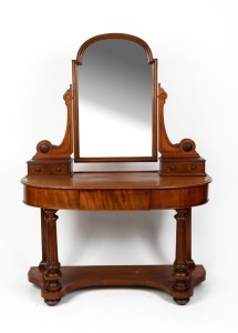 An antique English mahogany dressing table with central mirror, single drawer front supported by turned and fluted columns to the lower tier base, circa 1890, 166cm high, 120cm wide, 52cm deep