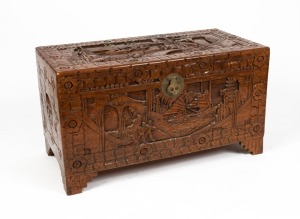 A vintage camphor wood blanket box, richly carved in the Oriental manner, 20th century, 58cm high, 103cm wide, 92cm deep