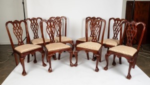 A set of eight Chippendale Revival mahogany ribbon back dining chairs with upholstered drop-in seats, acanthus carved cabriole front legs terminating on ball and claw feet, 20th century