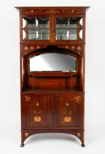 An antique English Art Nouveau&nbsp;style display cabinet in the manner of Liberty & Co., mahogany with brass and stained marquetry inlay, glazed with all round cushion-moulded&nbsp;glass panels, early 20th century, retailed by Buckley & Nunn of Melbourne and Londo