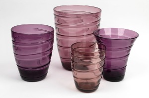 WHITEFRIARS&nbsp;four English amethyst glass vases with ribbon decoration, designed by Barnaby Powell,&nbsp;mid 20th century, the largest 28cm high