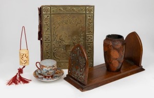 Antique English oak bookstand, Japanese porcelain teacup and saucer, carved bone inro,&nbsp;Australian pokerwork vase and an embossed brass book cover and assorted journals titled "PUNCH", 19th and 20th century, (6 items)