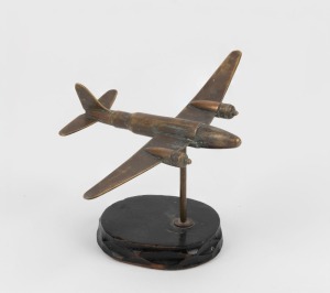 Trench Art: Military aircraft made from brass bullet casings, c. 1940s, 7cm high and 12.5m wingtip to wingtip.