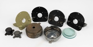 Group of fourteen c. 1940s R.A.A.F. aircraft compass parts - two compass bases, two compass correctors, four compass support brackets, and six compass glasses. (14 items)