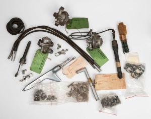 An accumulation of sixteen early aircraft parts, including two Tiger Moth luggage clamps. (16+ items)