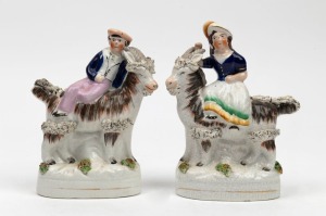 STAFFORDSHIRE pair of antique English pottery statues of figures riding goats, 19th century, the larger 16cm high