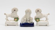 STAFFORDSHIRE&nbsp;English pottery pair of prancing French poodle statues, together with a French poodle figural group, 19th century, (3 items), the largest 11cm high
