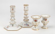MEISSEN&nbsp;pair of antique German floral porcelain miniature urns and a pair of candlesticks, 19th century, (4 items), blue crossed sword marks to the bases, the largest 13cm high