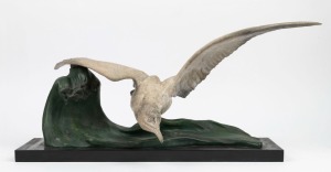 A French Art Deco cold painted spelter seagull statue mounted on black slate base, circa 1930, foundry mark and signature to the underside of the wing, 30cm high, 66cm wide