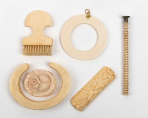 Ivory bangle, ivory and gold pendant, carved ivory floral brooch, carved ivory rose, turned ivory seal, and a carved ivory brush, 19th/20th century, (6 items), the seal 10cm long