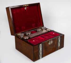 An antique English rosewood vanity case inlaid with mother of pearl and paua shell, interior fitted in magenta velvet with sterling silver topped jars, 19th century, 17cm high, 30cm wide, 23cm deep