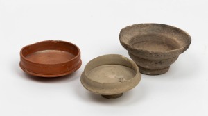 Three assorted Roman wine beakers, 1st-3rd century A.D., ​​​​​​​the largest 8.5cm wide