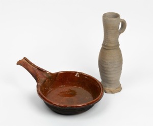 An antique Dutch terracotta cooking pan, 17th century; together with a Siegburg stoneware jug, 15th century, (2 items), the jug 25cm high