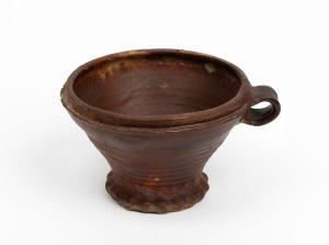 A Dutch stoneware vessel with ring handle, 15th/16th century, 11cm high, 20cm wide