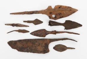 A Roman iron knife blade; together with two Roman iron arrow tips and five Medieval European iron arrow tips, (8 items), the knife 13cm long