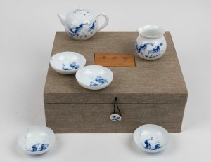 A Japanese blue and white porcelain tea set in fitted presentation case, 20th century, the case 32cm wide