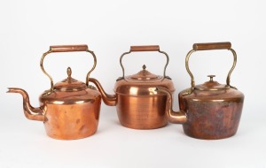Three antique and vintage copper and brass kettles, 19th/20th century, the largest 31cm high, 30cm wide