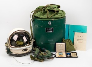 Chinese fighter pilot's helmet, housed in a green finished case, together with two Masonic gold finished medals, (3 items)