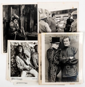 MOVIE STILLS: Thirteen assorted black and white promotional photographs from the 1950-1980s, including Charlie Chaplin, James Bond and 100 Rifles, approximate sheet size 20.5 x 25.5cm each overall