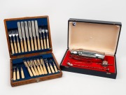 An antique bone handle silver plated fruit cutlery set in oak canteen; together with a vintage cocktail shaker set in box, 19th and 20th century, (2 items)