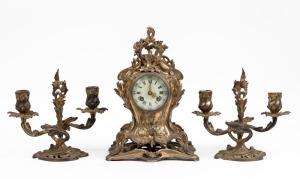 An antique French three piece Rococo revival clock set in cast brass case with eight day time and bell striking movement, 19th century, the back plate stamped "A.1.", 31cm high