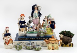 STAFFORDSHIRE assorted antique English pottery figures; together with two books on collecting Staffordshire pottery, an English cottage teapot and four Continental floral porcelain ornaments, 19th and 20th century, (13 items), the largest 19cm high