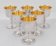 A set of six Queen Elizabeth II sterling silver goblets with gilt wash interiors, housed in fitted case, by Barker Ellis Silver Co. of Birmingham, circa 1971, the goblets 12cm high, the case 29cm wide, 908 grams total