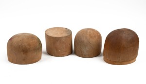 Four assorted vintage hat blocks, huon pine and cypress pine, the largest 15cm high