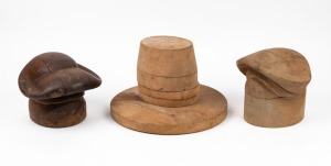Three vintage hat blocks of ornate design, the largest 22cm high