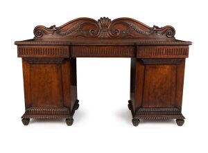 An antique Anglo-Indian padouk twin pedestal sideboard with carved Thomas Hope scrolled back, early to mid 19th century, ​​​​​​​122cm high, 184cm wide, 63cm deep