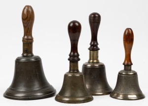 Four assorted antique bells with turned wooden handles, 19th century, the largest 27cm high