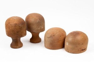 Four assorted Tasmanian huon pine vintage hat blocks, stamped "Godfrey, Melbourne", two with stands, the largest 24cm high