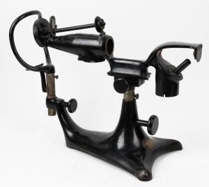 An antique ophthalmoscope with original black finish and patent plaque, 19th century, ​​​​​​​40cm high, 54cm wide